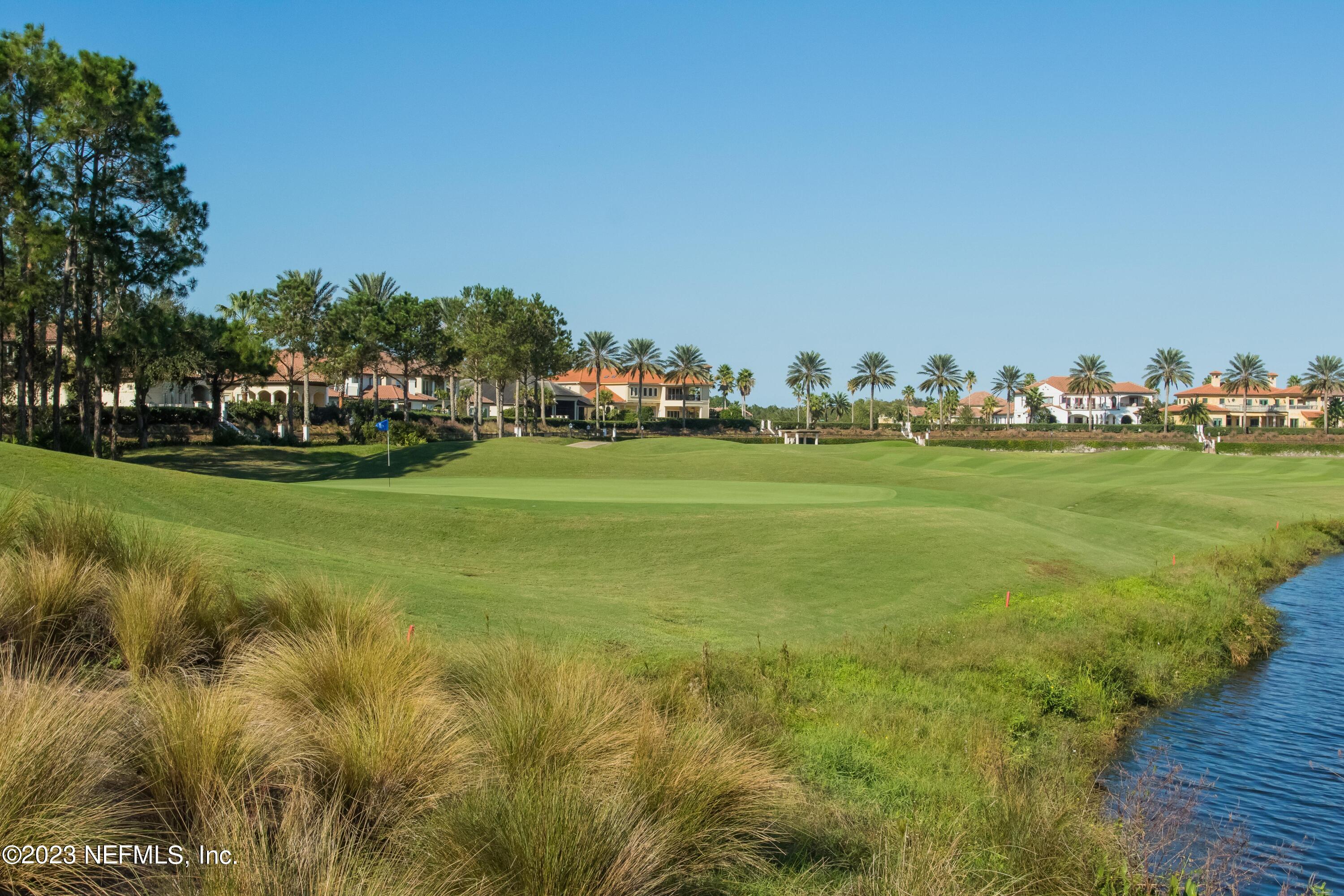 77 Glorieta Drive St. Augustine, FL 32095 - Photo 55 of 67 a view of a field with a big yard and a large trees