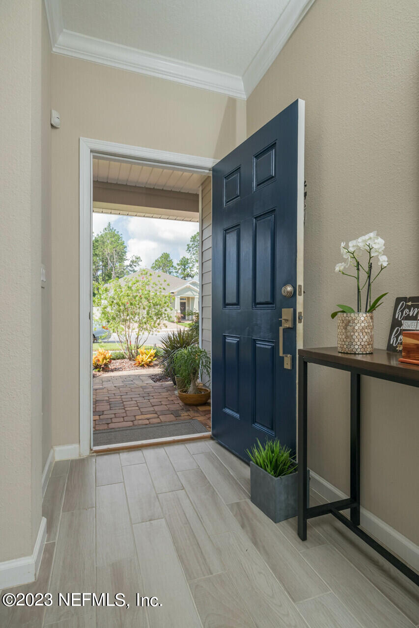 77 Glorieta Drive St. Augustine, FL 32095 - Photo 7 of 67 a view of hallway with furniture and floor to ceiling window