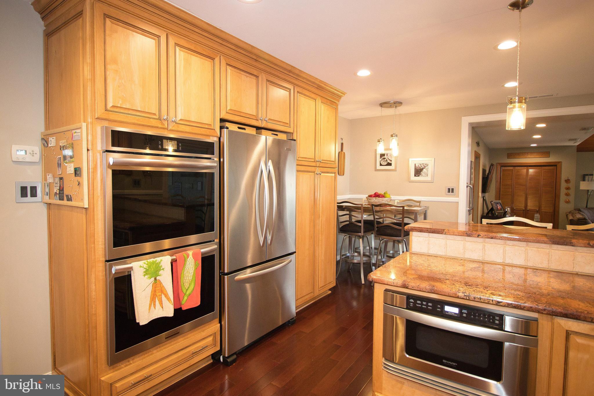 136 Washington Drive Warminster, PA 18974 - Photo 11 of 39 a kitchen with wooden cabinets and stainless steel appliances