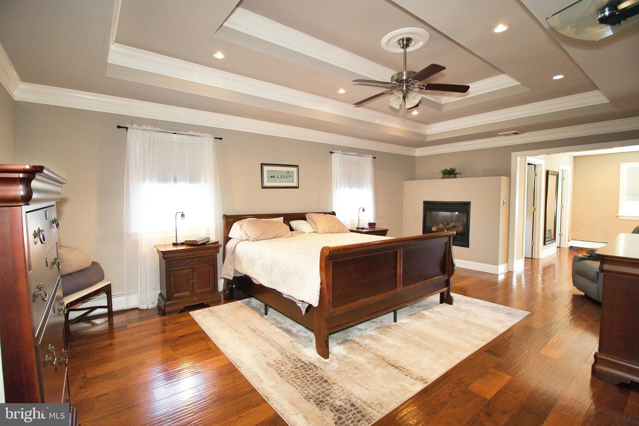 136 Washington Drive Warminster, PA 18974 - Photo 16 of 39 a bedroom with a bed and wooden floor