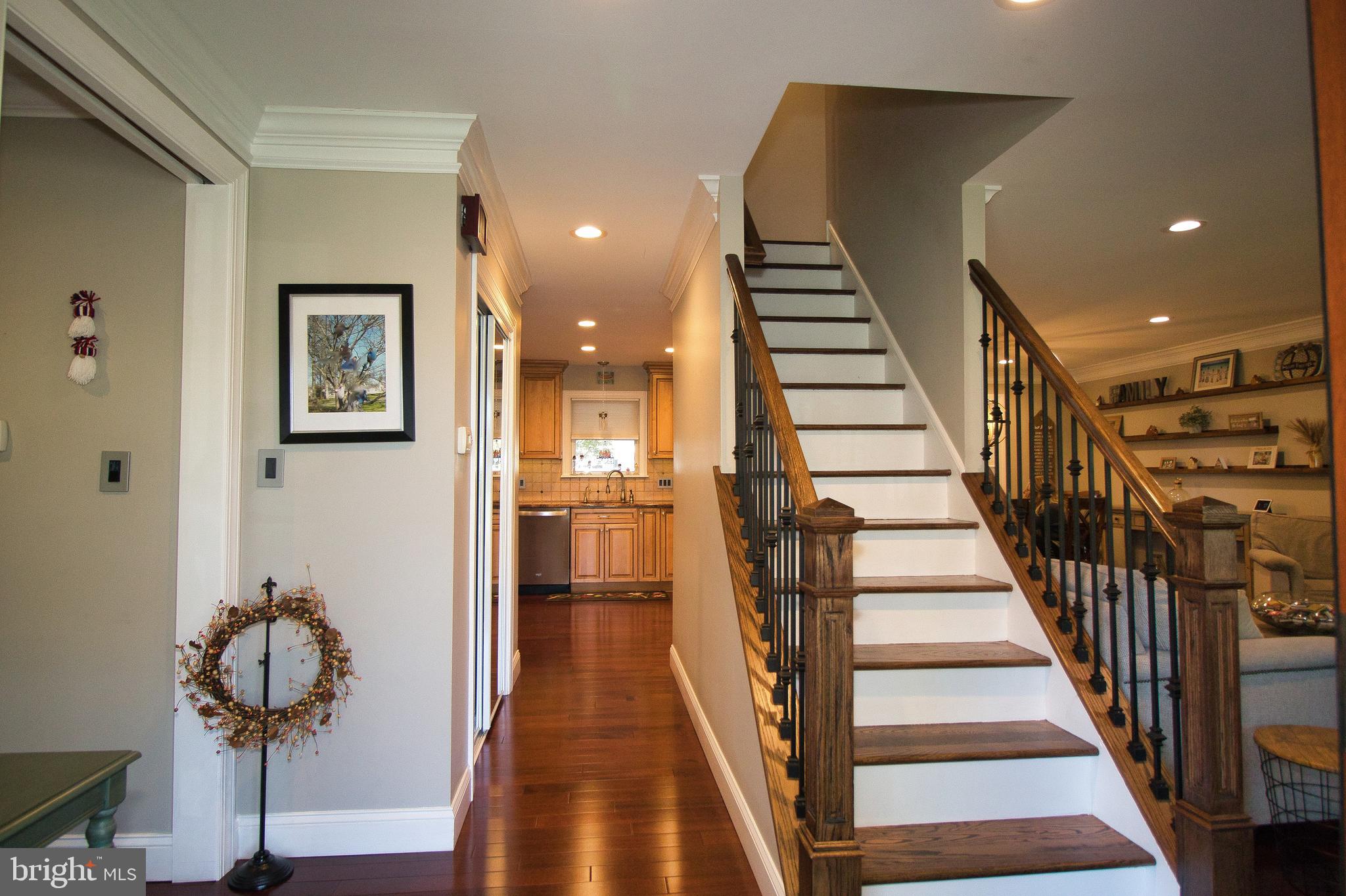 136 Washington Drive Warminster, PA 18974 - Photo 2 of 39 a view of entryway and hall with wooden floor