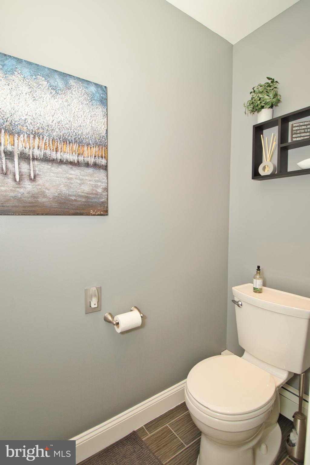136 Washington Drive Warminster, PA 18974 - Photo 21 of 39 a white toilet sitting next to a bathroom sink