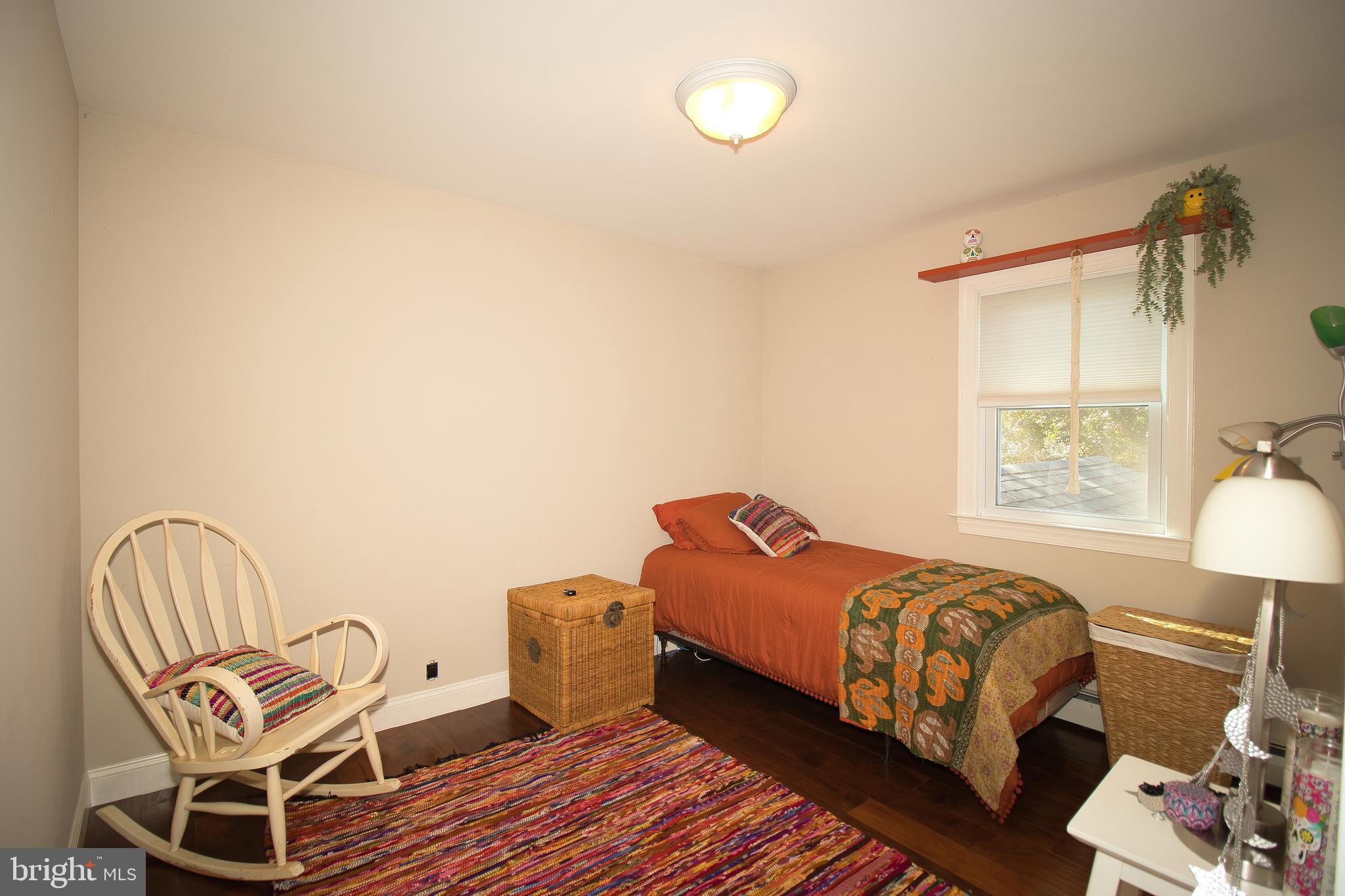 136 Washington Drive Warminster, PA 18974 - Photo 26 of 39 a bedroom with a bed chair and lamp