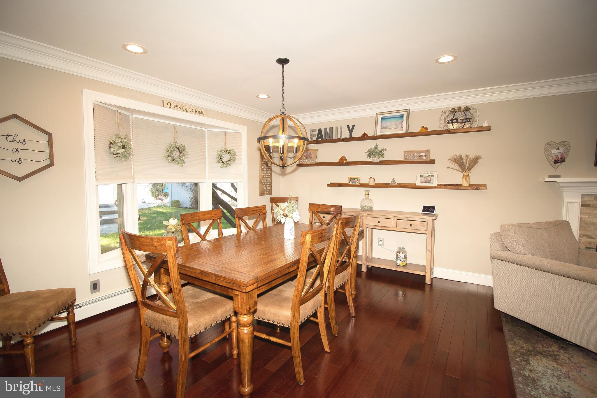 136 Washington Drive Warminster, PA 18974 - Photo 6 of 39 a dining room with furniture and wooden floor