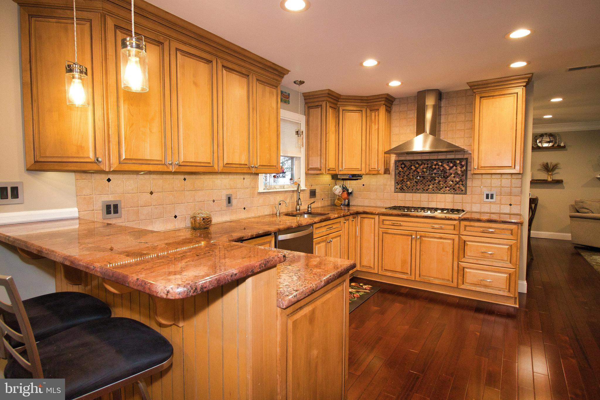 136 Washington Drive Warminster, PA 18974 - Photo 9 of 39 a kitchen with a sink stove and cabinets
