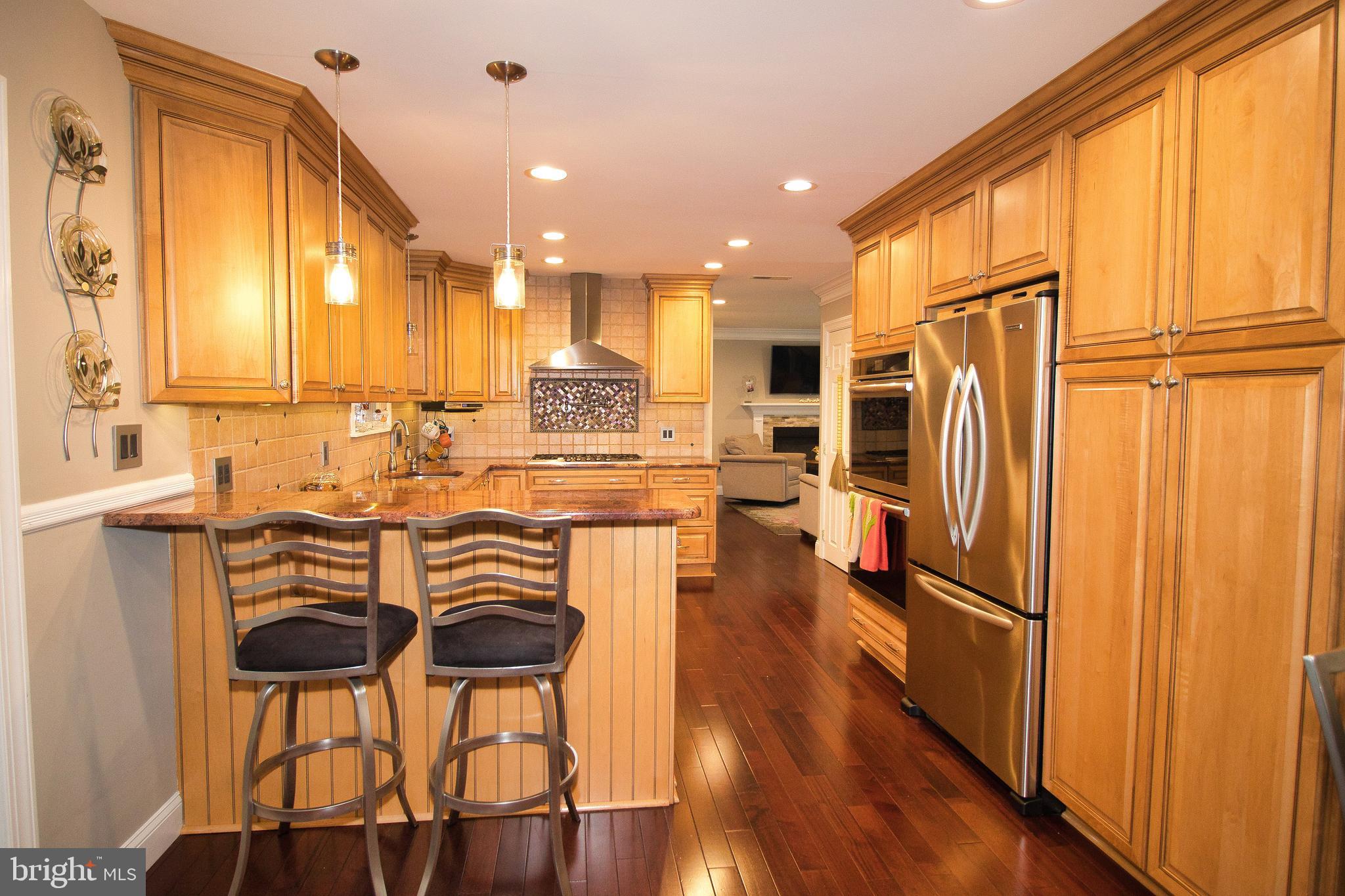 136 Washington Drive Warminster, PA 18974 - Photo 10 of 39 a view of a kitchen with kitchen island granite countertop wooden floor and furniture