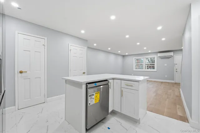 a view of cabinets a sink with wooden floor