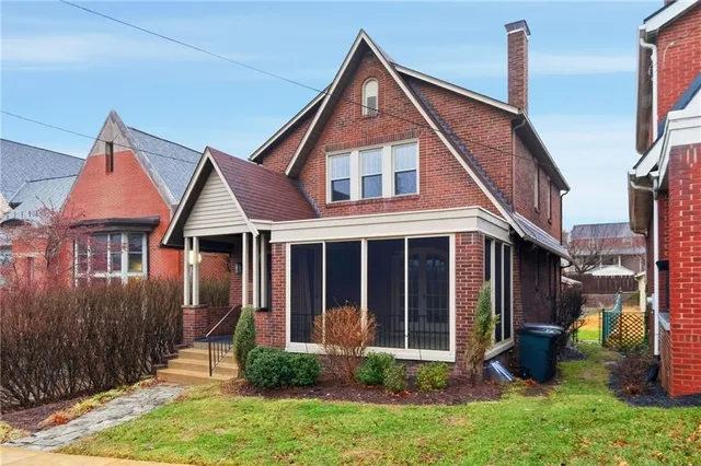 front view of a house with a yard