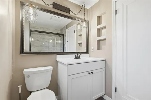 a bathroom with a glass shower door