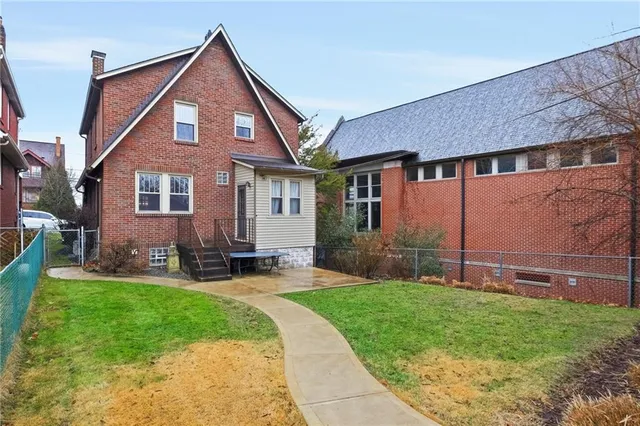a view of a door with a door and wooden floor