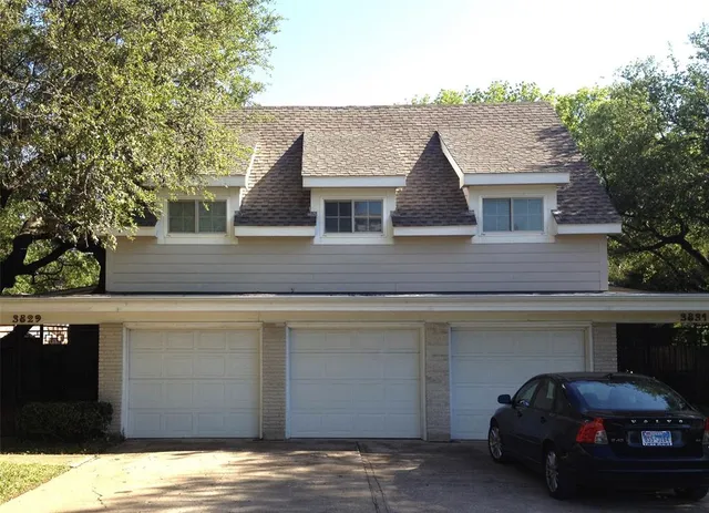 a front view of a house with parking