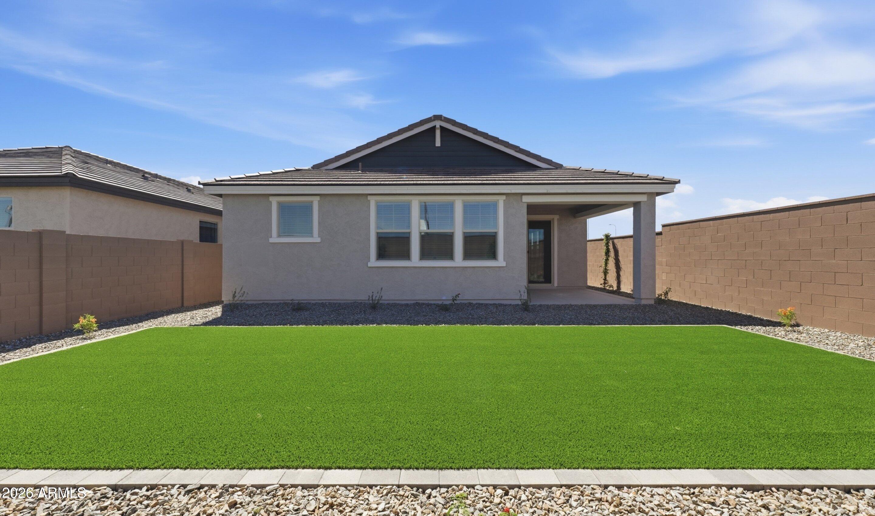 7760 West Sands Road Glendale, AZ 85303 - Photo 16 of 20 a front view of a house with a yard