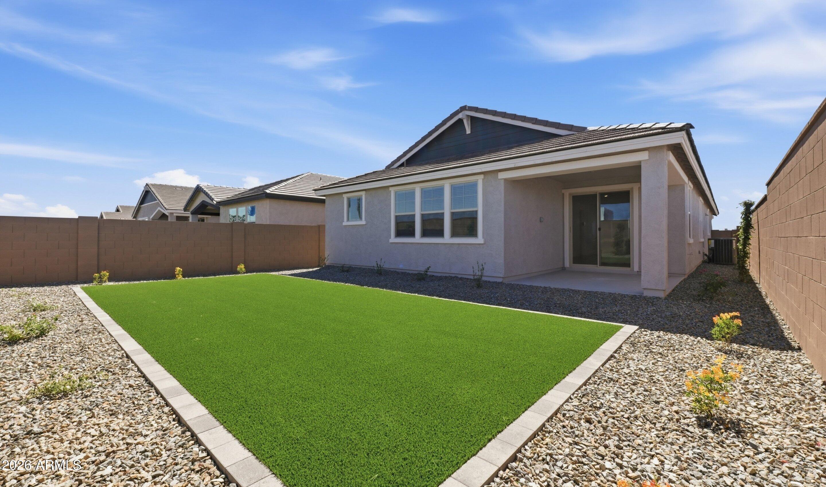 7760 West Sands Road Glendale, AZ 85303 - Photo 17 of 20 a front view of a house with a garden
