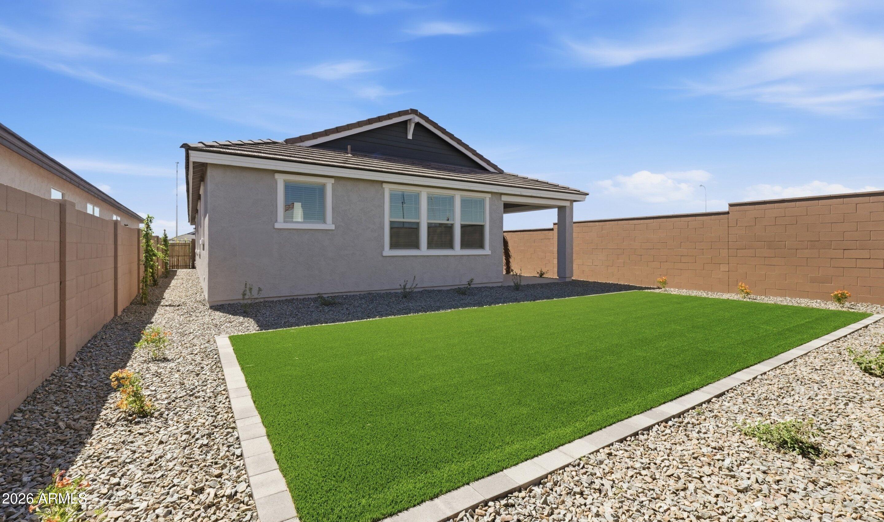 7760 West Sands Road Glendale, AZ 85303 - Photo 18 of 20 a front view of a house with garden