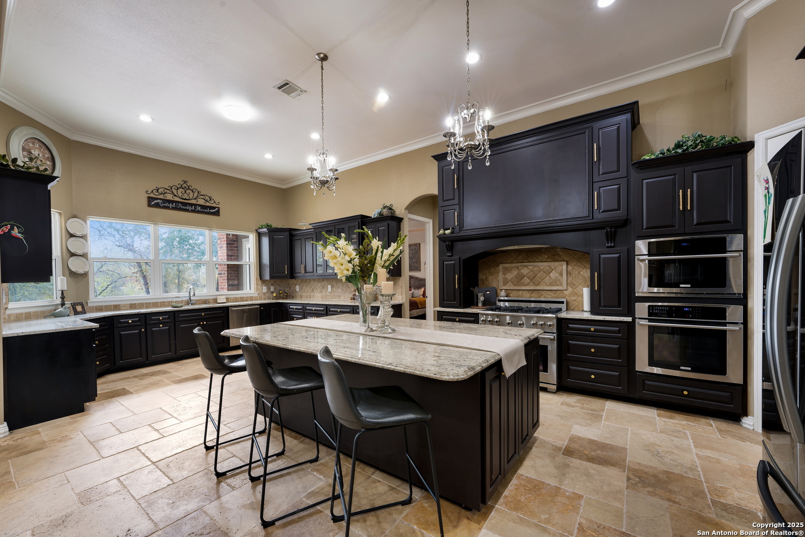 22580 Priest Road Elmendorf, TX 78112 - Photo 1 of 1 a kitchen with cabinets a sink and appliances