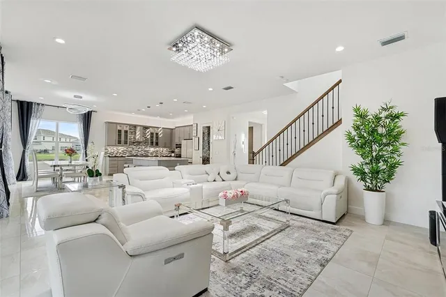 a large white bed in a white room