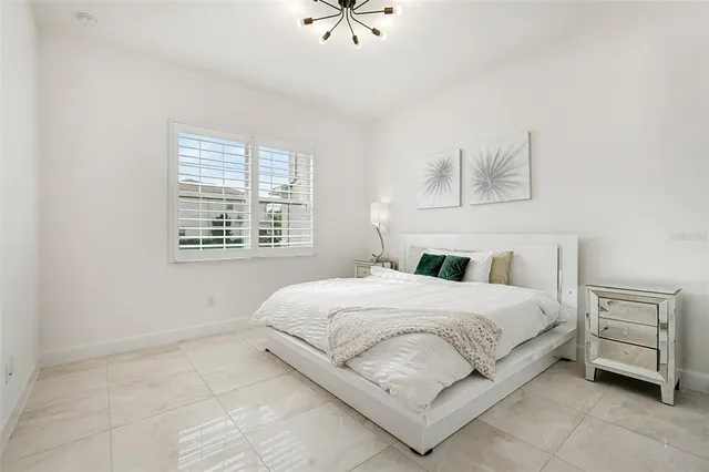 a bathroom with a granite countertop sink a toilet a mirror and shower