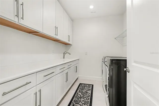 a bedroom with a bed and a ceiling fan