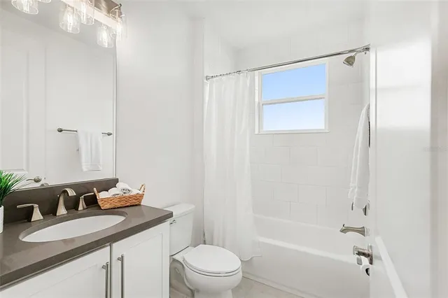 a view of a house with pool table and chairs