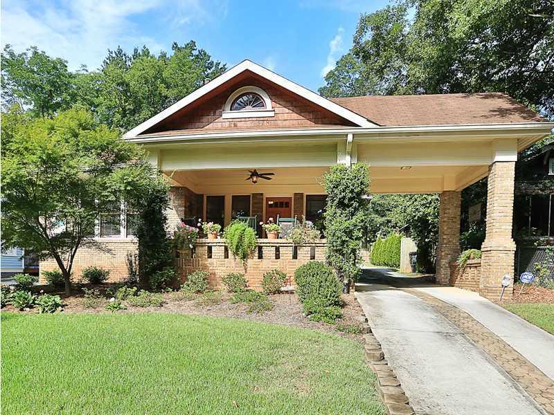 Exterior Front. Beautiful Brick Craftsman with Porte-cache and Porch located in the Heart of Oakhurst.