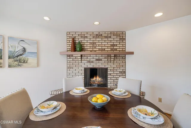 a table with white and a table and chairs in it