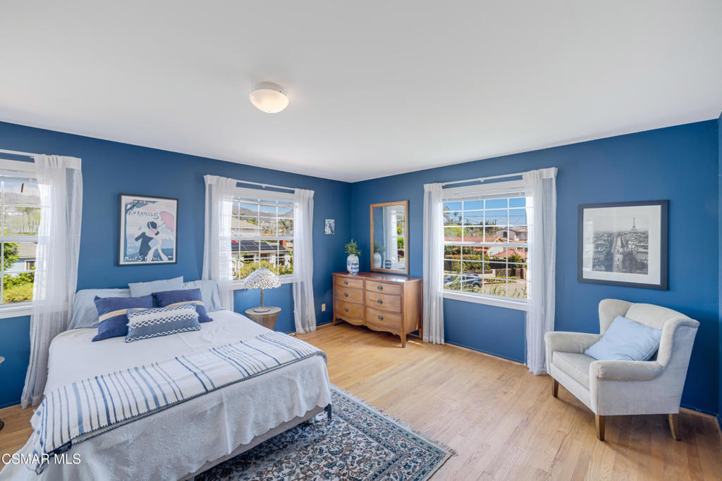 1884 Channel Drive Ventura, CA 93001 - Photo 22 of 62 a spacious bedroom with a bed and glass window