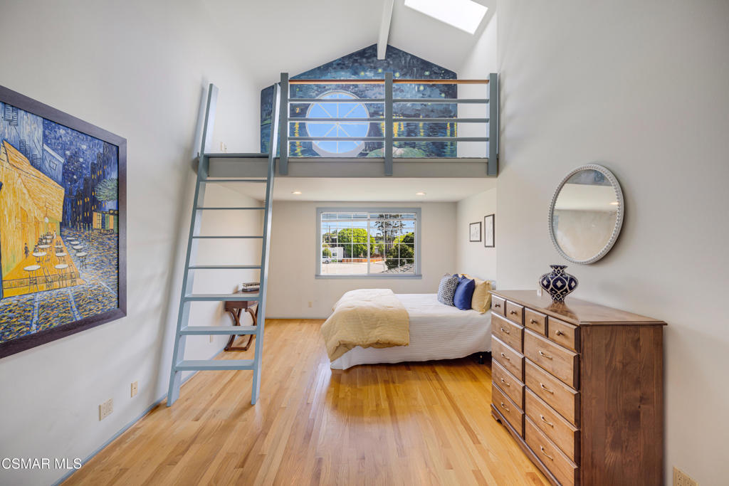 1884 Channel Drive Ventura, CA 93001 - Photo 24 of 62 a bedroom with a bed and wooden floor