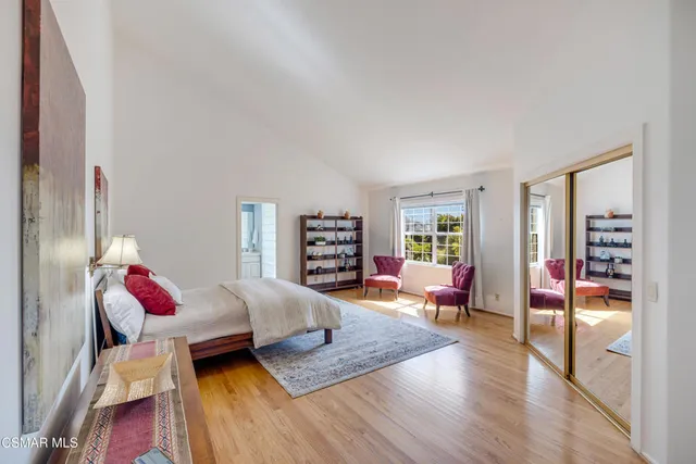 a bedroom with a bed and closet