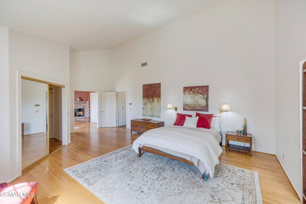 1884 Channel Drive Ventura, CA 93001 - Photo 27 of 62 a bedroom with a bed and wooden floor