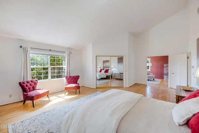 a living room with furniture a fireplace and a table