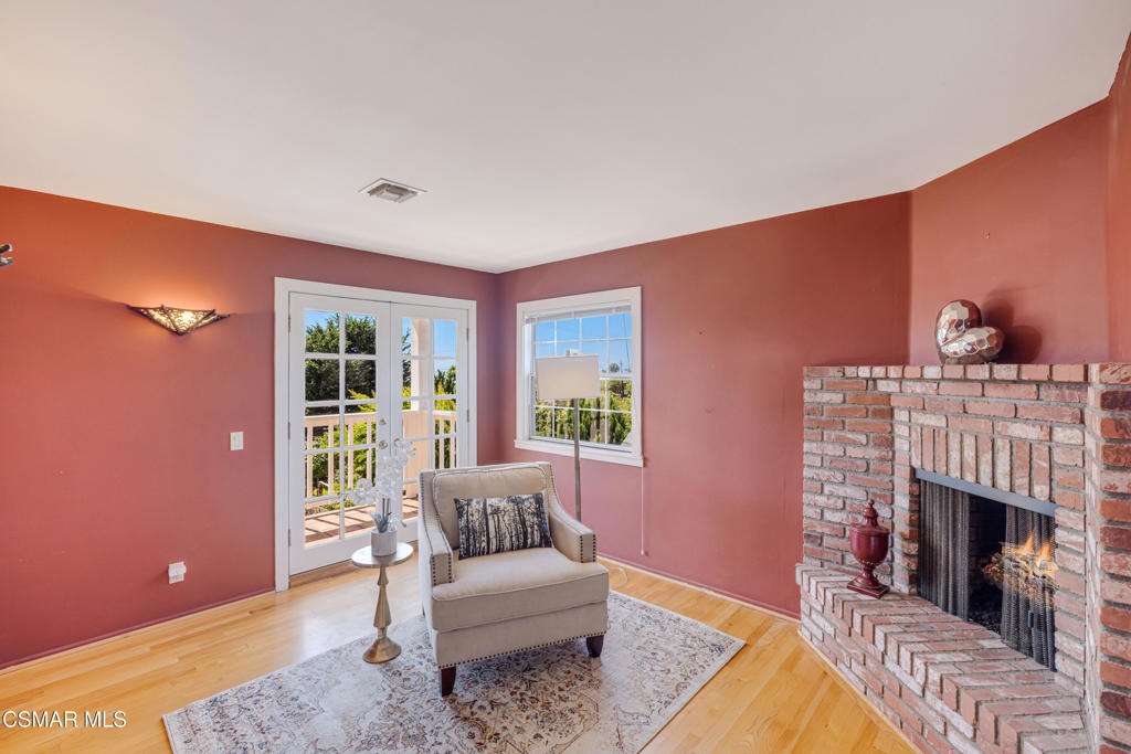 1884 Channel Drive Ventura, CA 93001 - Photo 29 of 62 a living room with furniture a fireplace and a table