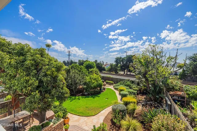 a bathroom with a double vanity sink mirror and shower