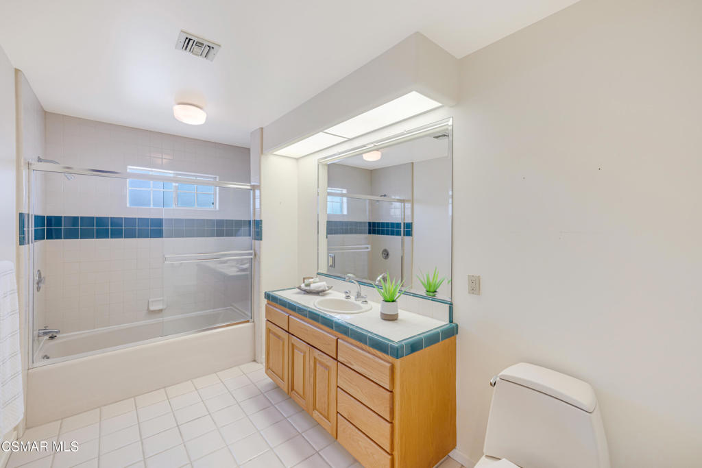 1884 Channel Drive Ventura, CA 93001 - Photo 35 of 62 a bathroom with a tub sink and mirror