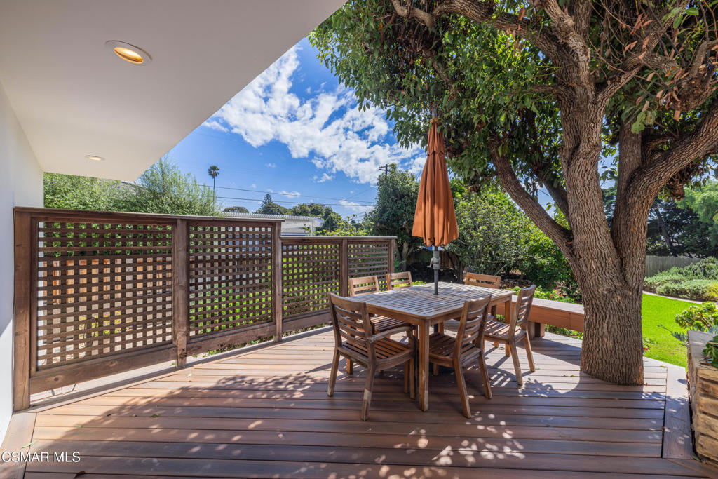 1884 Channel Drive Ventura, CA 93001 - Photo 37 of 62 a view of a roof deck with table and chairs and wooden floor