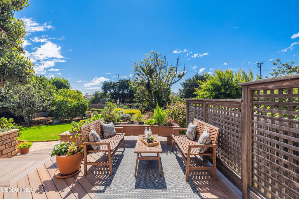 1884 Channel Drive Ventura, CA 93001 - Photo 38 of 62 a view of a patio with couches and table and chairs and potted plants