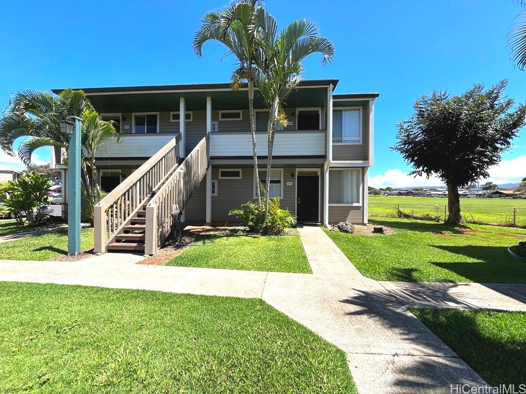 95-670 Hanile Street, Unit A102 Mililani, HI 96789 - Photo 1 of 13 a view of a house with a yard