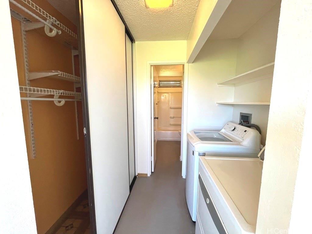 95-670 Hanile Street, Unit A102 Mililani, HI 96789 - Photo 11 of 13 a utility room with a sink dryer and washer