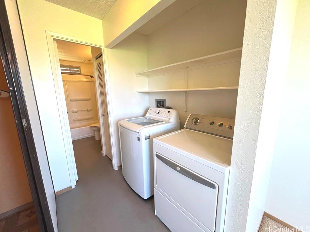 95-670 Hanile Street, Unit A102 Mililani, HI 96789 - Photo 12 of 13 a utility room with dryer and washer