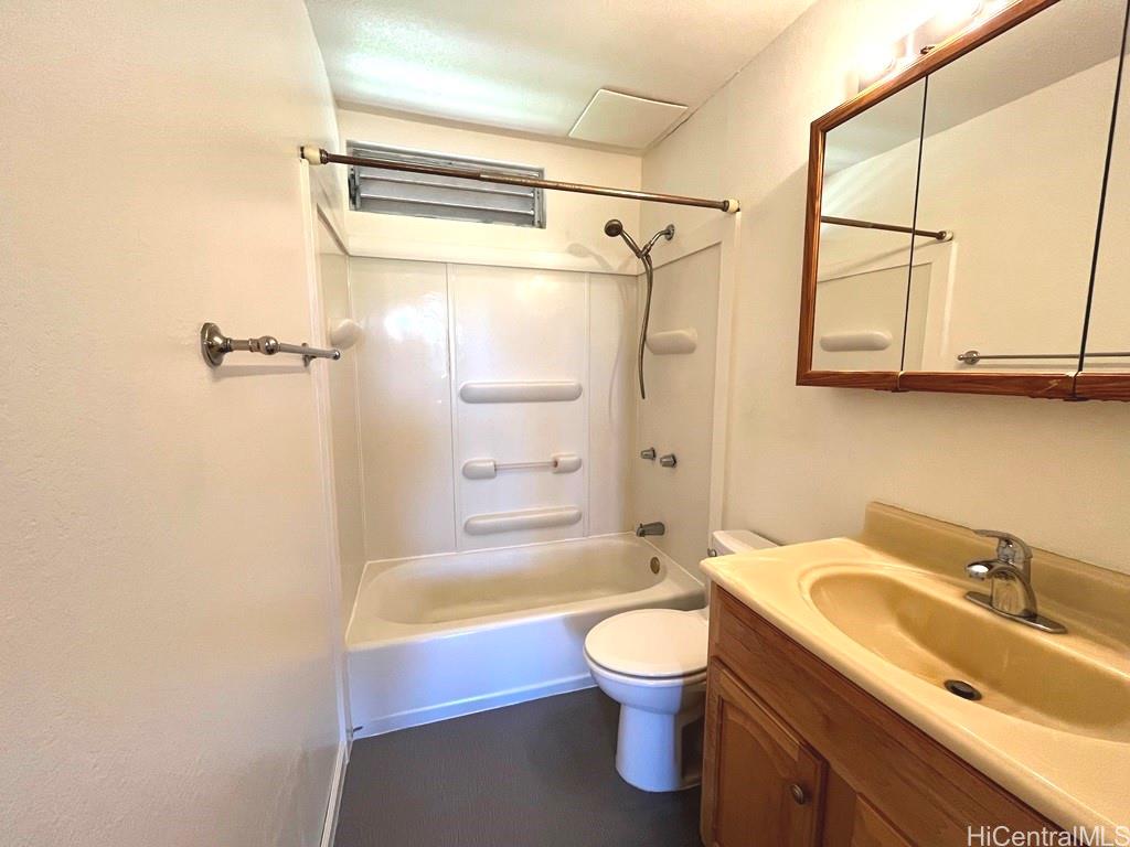 95-670 Hanile Street, Unit A102 Mililani, HI 96789 - Photo 13 of 13 a bathroom with a sink a toilet and shower