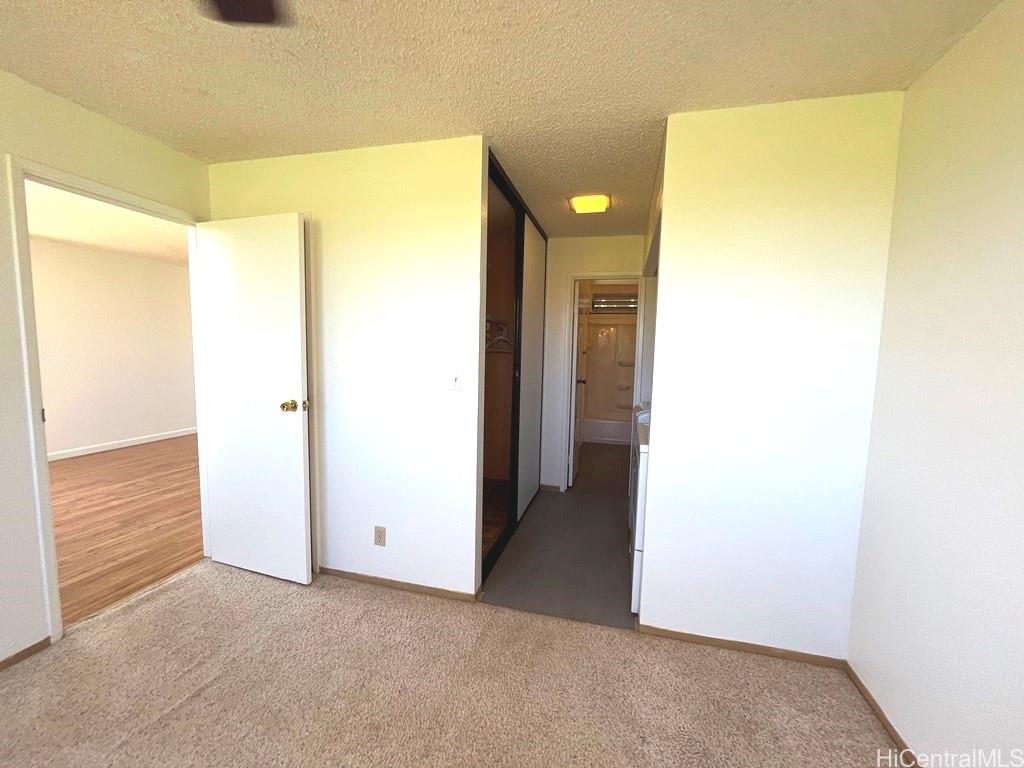 95-670 Hanile Street, Unit A102 Mililani, HI 96789 - Photo 10 of 13 a view of an empty room