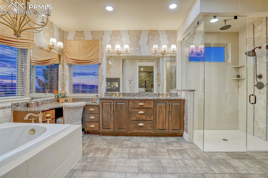 1935 Bashley Road Monument, CO 80132 - Photo 21 of 45 a large bathroom with a large tub shower and sink