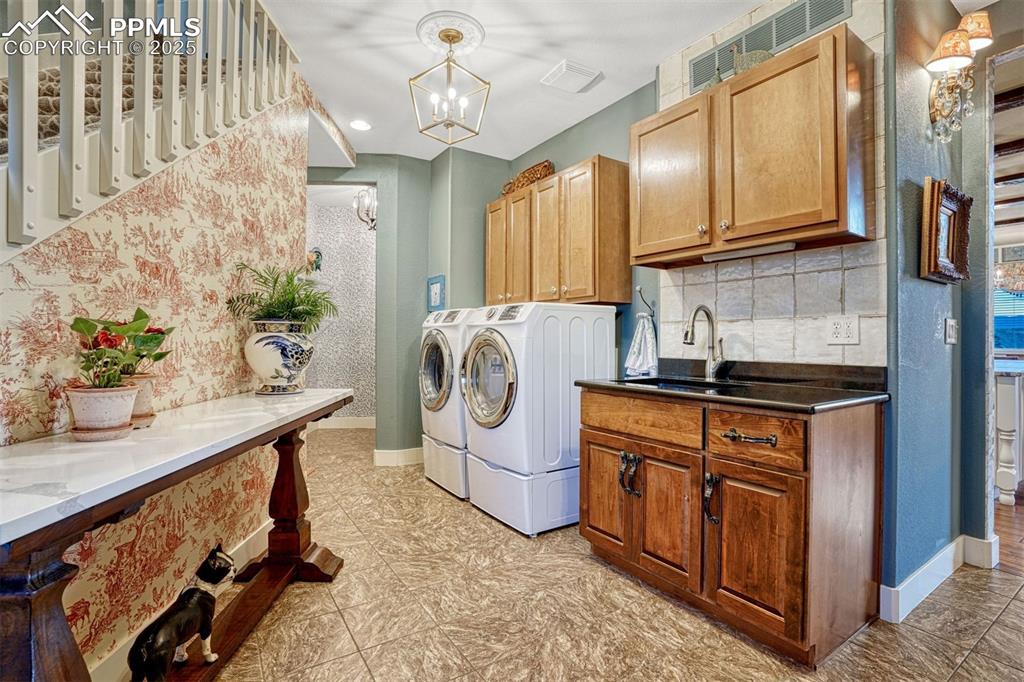 1935 Bashley Road Monument, CO 80132 - Photo 22 of 45 a kitchen with stainless steel appliances granite countertop a sink a stove and a refrigerator