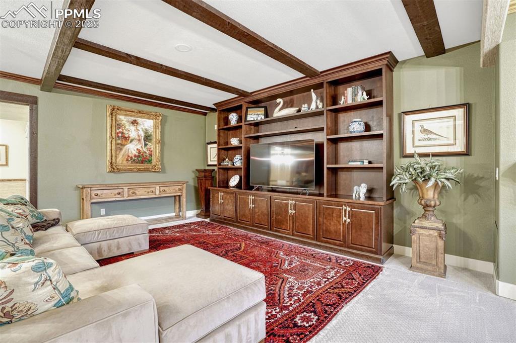 1935 Bashley Road Monument, CO 80132 - Photo 29 of 45 a living room with furniture and a flat screen tv