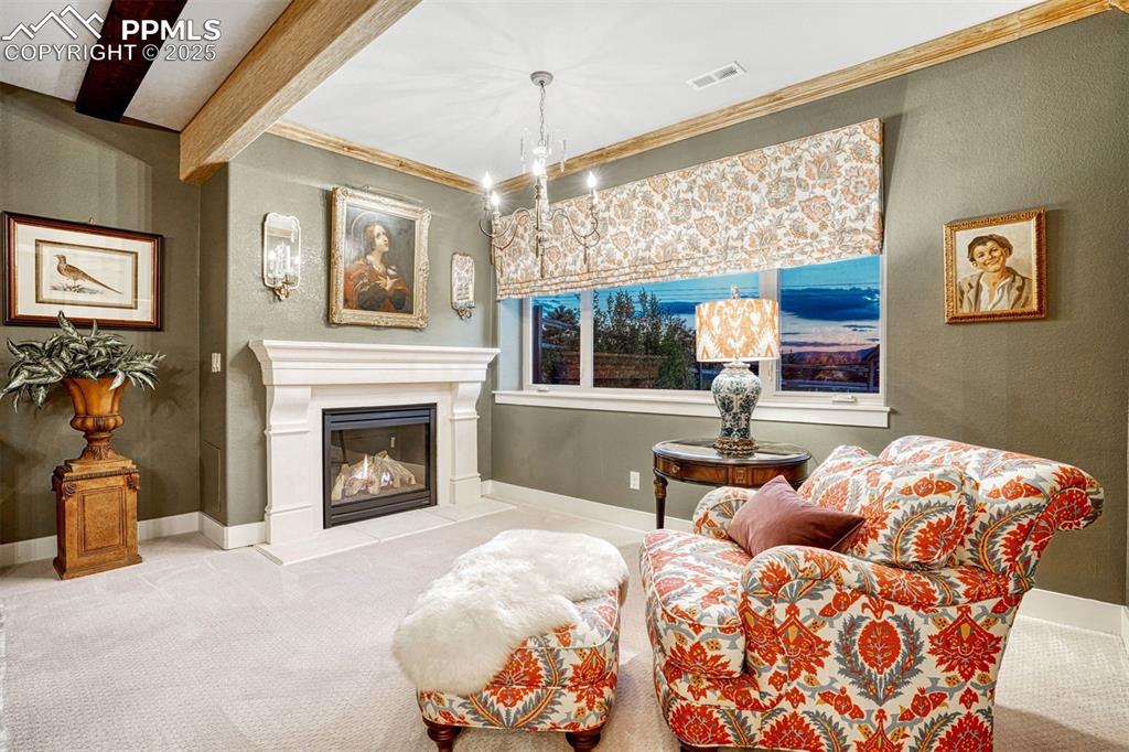 1935 Bashley Road Monument, CO 80132 - Photo 30 of 45 a bedroom with a bed and a fireplace