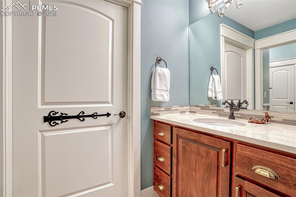 1935 Bashley Road Monument, CO 80132 - Photo 37 of 45 a bathroom with a sink double vanity and a mirror