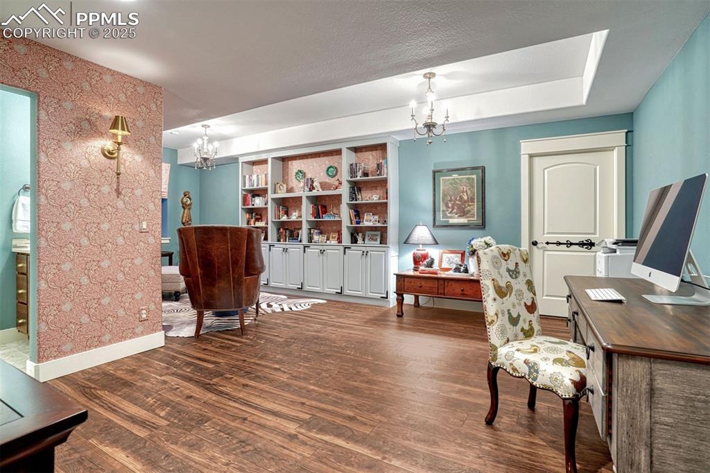 1935 Bashley Road Monument, CO 80132 - Photo 39 of 45 a bedroom with furniture and a wooden floor