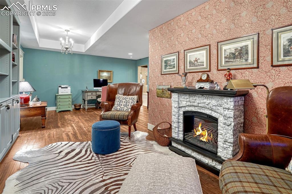 1935 Bashley Road Monument, CO 80132 - Photo 40 of 45 a living room with furniture and a fireplace