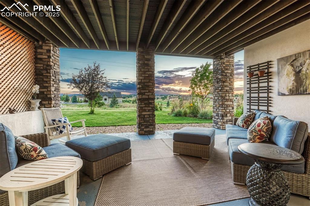 1935 Bashley Road Monument, CO 80132 - Photo 41 of 45 a outdoor living space with patio furniture and a garden