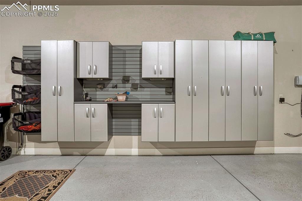 1935 Bashley Road Monument, CO 80132 - Photo 42 of 45 a kitchen with stainless steel appliances granite countertop a refrigerator and a sink