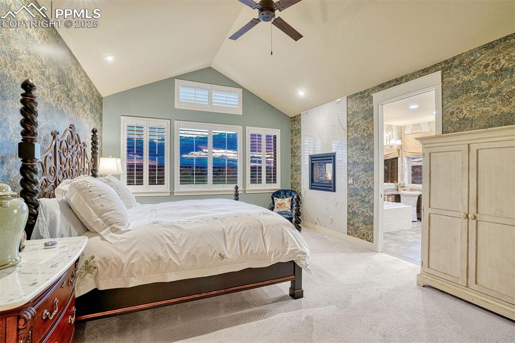 1935 Bashley Road Monument, CO 80132 - Photo 5 of 45 a bed room with a bed and a large window